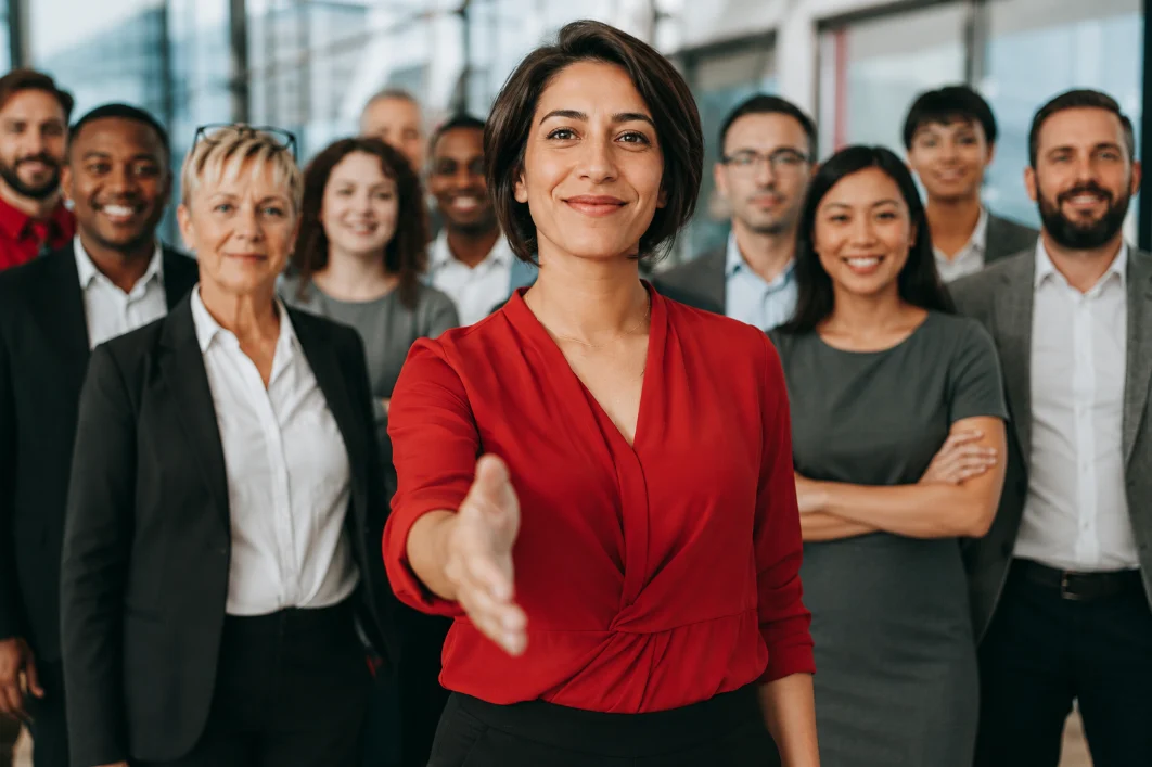 Hotline Statistics A group of satisfied employees in a modern workplace, symbolic of the benefits reflected in fraud hotline statistics, whistleblower reporting, and fraud detection trends from the ACFE Report to the Nations 2026.